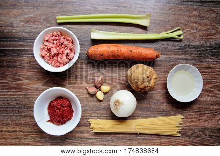 Ingredients For Spaghetti Bolognese On Wooden Background