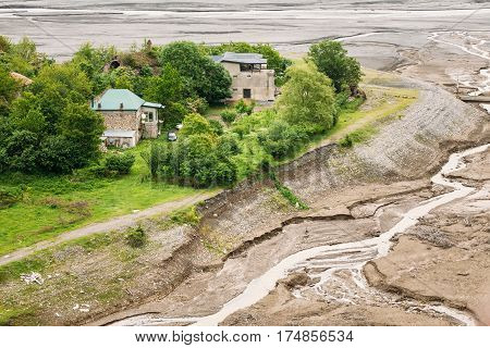 Houses On Aragvi River Bank Near Castle Complex Ananuri In Georgia, About 72 Kilometres From Tbilisi.