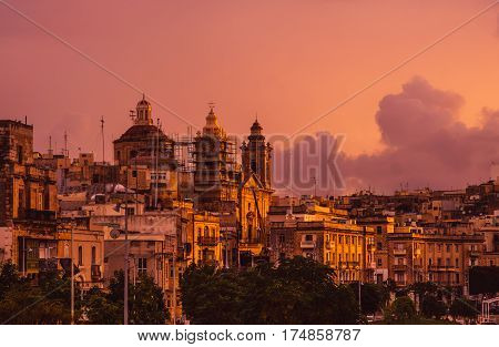 Pink Evening In Cospicua And View To Immaculate Conception Church