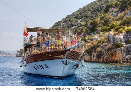 Antalya Turkey - 28 august 2014: Excursion yacht with many tourists in the Mediterranean Sea near Kekova island Demre of Antalya.