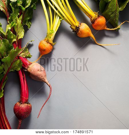 Mix Of Red And Gold Beets On Grey Background. Food Background. Concept Of Healthy Eating