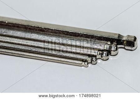 Hex key Set on white background.A hex key, Allen key or Allen wrench is a tool used to drive bolts and screws with hexagonal sockets in their heads.