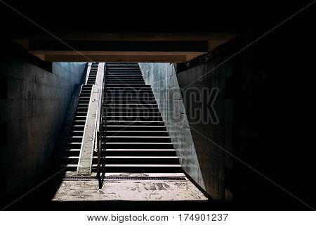 Stairs underpasses in the sunlight dark contrast image