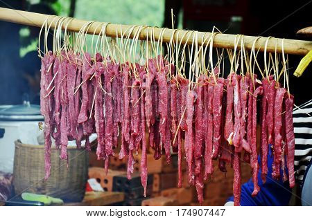 Laotian People Cooking Pork Roasted And Entrails Of Pig Grilled For Sale On Old Stove