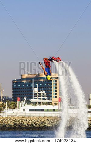 Background view man on flayborde doing Extreme stunt with a coup At competitions on extreme kinds of sports in Sky dive Dubai