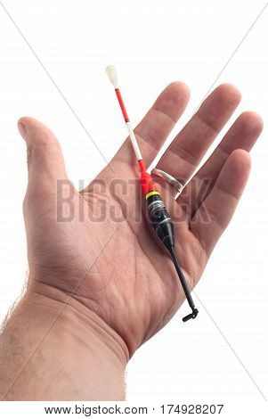 the fishing float in hand isolated on white background fishing tackle hand-in-fisherman