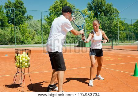 Tennis lesson outdoors, summer time,  color image