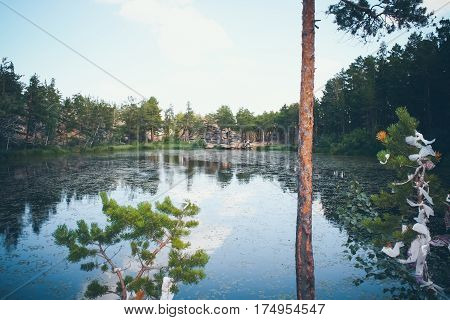 Mountain lake in the background of mountains and blye sky