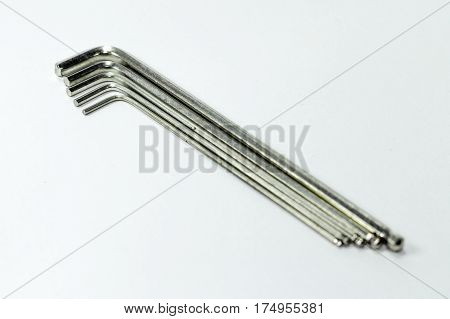 Hex key Set on white background.A hex key, Allen key or Allen wrench is a tool used to drive bolts and screws with hexagonal sockets in their heads.