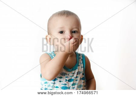 Baby eats a pomegranate ripe and juicy very tasty and joyfully
