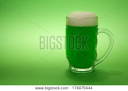 St Patrick's day green beer on a green light background