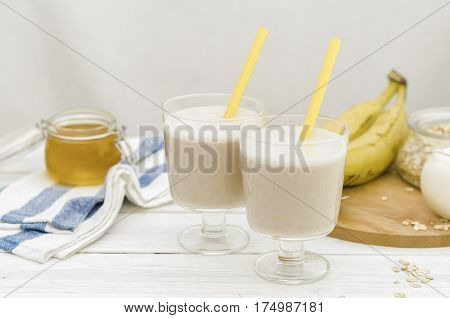 Milk shake with banana, oatmeal and honey, healthy breakfast