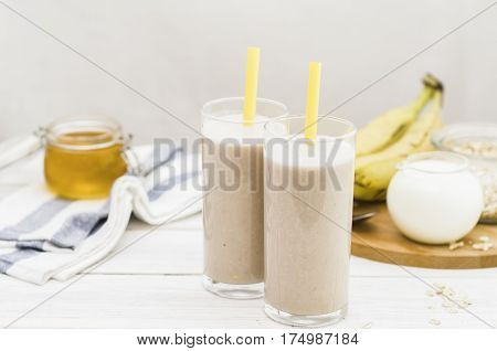 Milk shake with banana, oatmeal and honey, healthy breakfast