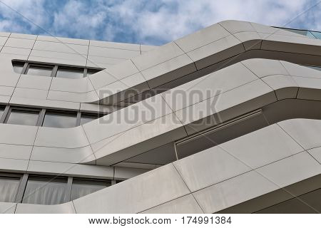 MILAN ITALY-September 2015: Urban Geometry looking up to white metal cladded new modern residential building houses of City Life business and residential district in Milan. Designed by Zaha Hadid Architects