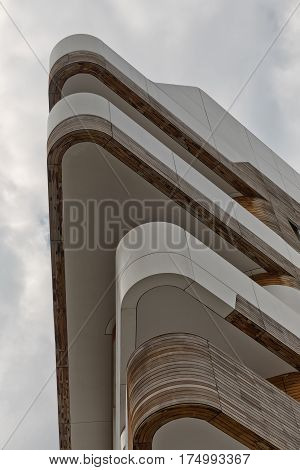 MILAN ITALY-September 2015: Urban Geometry looking up to wooden and white metal cladded corner of new modern residential building houses of City Life business and residential district in Milan. Designed by Zaha Hadid Architects