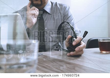 Business Man Using Voip Headset With Digital Tablet Computer Docking Smart Keyboard Concept Communic