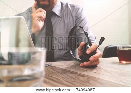 Business Man Using Voip Headset With Digital Tablet Computer Docking Smart Keyboard Concept Communic