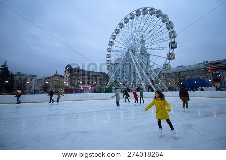 Kiev, Ukraine - December 28, 2017: Peoples Skate On A Skating Rink On Kontraktova Square