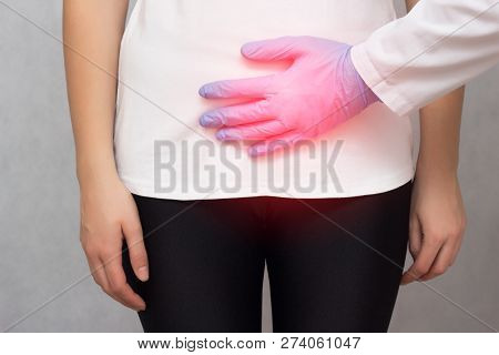 A Doctor In Medical Gloves Holds A Girl By The Lower Abdomen Which Has Problems With Menstruation An