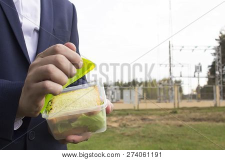Male Chief Engineer Snacks In The Workplace, Energy, Proper Nutrition, Copy Space, Close-up, Outdoor