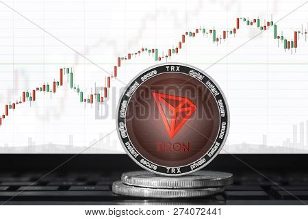 Tron (trx) Cryptocurrency; Tron Coin On The Background Of The Chart