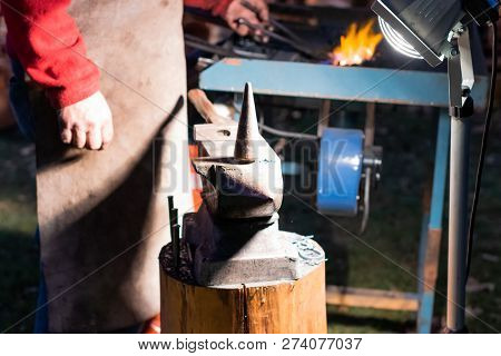 A Craftsman Working With Fire And A Hammer On A Glowing Iron. Middle Age, Flame, Metal, Handmade;