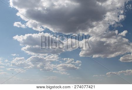 Sunny Day. The Sun Through The Clouds