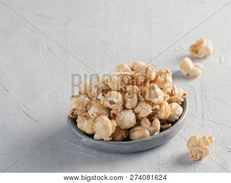 Popcorn In Gray Craft Trendy Plate On Gray Concrete Background. Moovie Background With Copy Space. T