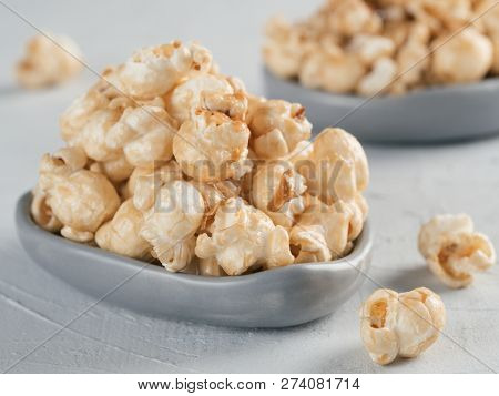 Popcorn In Gray Craft Trendy Plate On Gray Concrete Background. Moovie Background With Copy Space. T