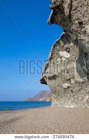 Vela Blanca Tower Over Black Cape From Monsul Beach In Cabo De Gata Natural Park