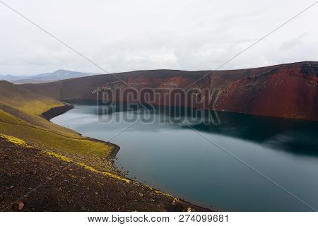 Volcanic Crater With Water Near Landmannalaugar Area, Iceland. Colored Mountains