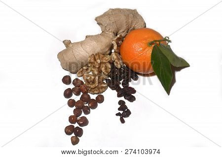 Raisins Hazlenuts, Walnuts Ginger And Mandarin Fruit. Healthy Christmas Food