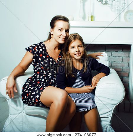 Portrait Of Smiling Young Mother And Daughter At Home, Happy Fam