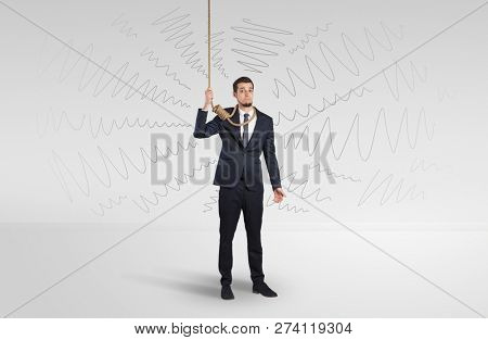 Hopeless young businessman trying to suicide with question signs concept