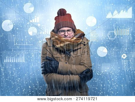 Young businessman shivering with graphs, reports and chart concept