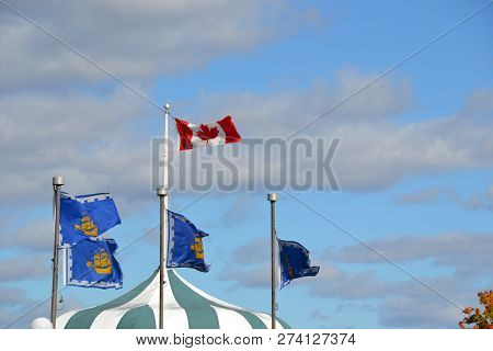 Canadian Flag Sourrounded By Quebec City Flags