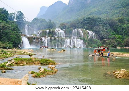 Cao Bang, Vietnam - Nov 30, 2018 : Tourist Visiting Ban Gioc Waterfall Or Detian Falls By Bamboo Boa