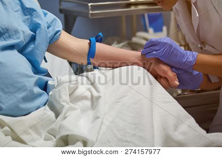 Close-up Of Making Catheter Hole In Patient Hand