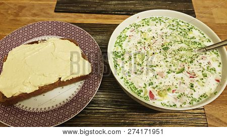 Cold Soup With Cucumbers, Yogurt On Table. Bread With Hummus.