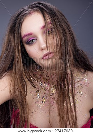 Portrait Of Sexy Young Woman With Wet Hair. Neutral Face Makeup With Glitter. Dark Gray Background