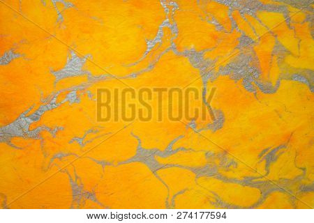 background of textured handmade Thai marbled momi mulberry paper with a random pattern