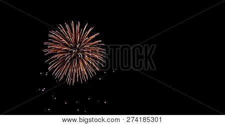 Glod And Yellow Fireworks On Night Sky With Black Backgrounds.