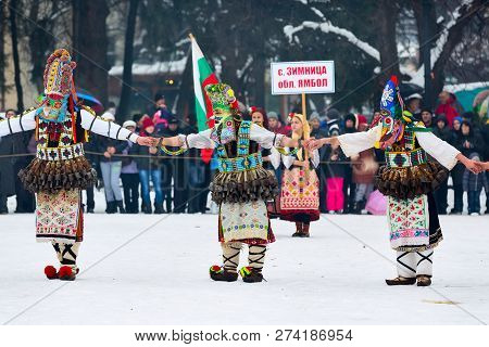 Razlog, Bulgaria - January 14, 2017: People In Traditional Carnival Kuker Costumes At Kukeri Festiva