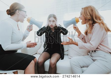 Upset Teenage Daughter In Jacket In Psychologist Office With Mother. Punk In Lather Jacket. Communic