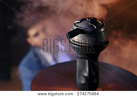 Clay Shisha Bowl With Craft Flawoured Tobacco And Red Hot Coconut Coil With Hookah Smoke Black Backg