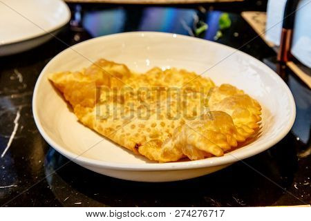 Traditional Tatar Dish, Chebureki. Puff Pastry Pie With Meat Filling.