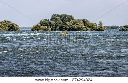 Lasalle, Quebec - August 15, 2018 - Horizontal Of A Group Of Fun Seekers, Water Rafting Down The Lac
