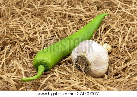 Green Pepper And Garlic With Straw. Chilli Pepper, Garlic Vegeta