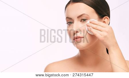 Home Face Care. Girl Remove Makeup. Woman Hand With Pad. Skin Clean With Cotton