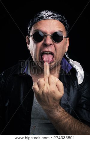 Rock star making facial expression and hand gesture
